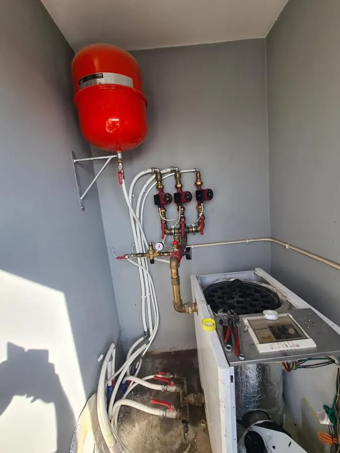 Boiler room with circulator pumps and expansion vessel
