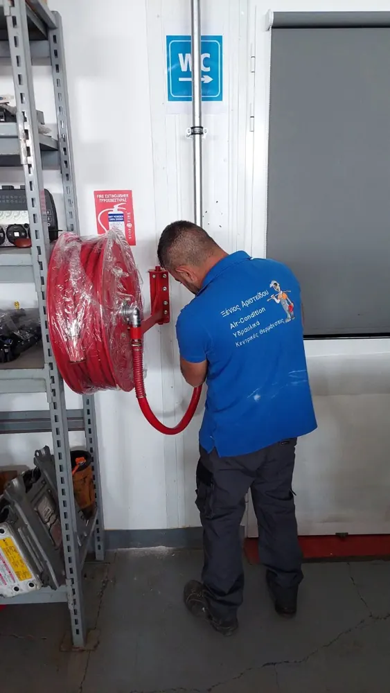 Installing a fire hose reel in a commercial building