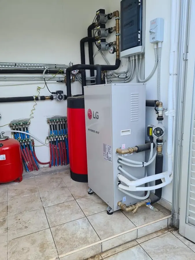 LG Hydro Kit heat pump plant room with buffer tank and underfloor manifolds