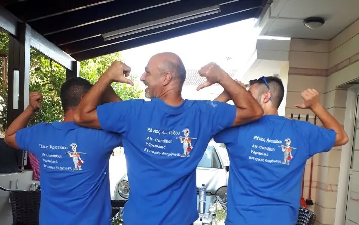 The WaterheatX team in branded work shirts